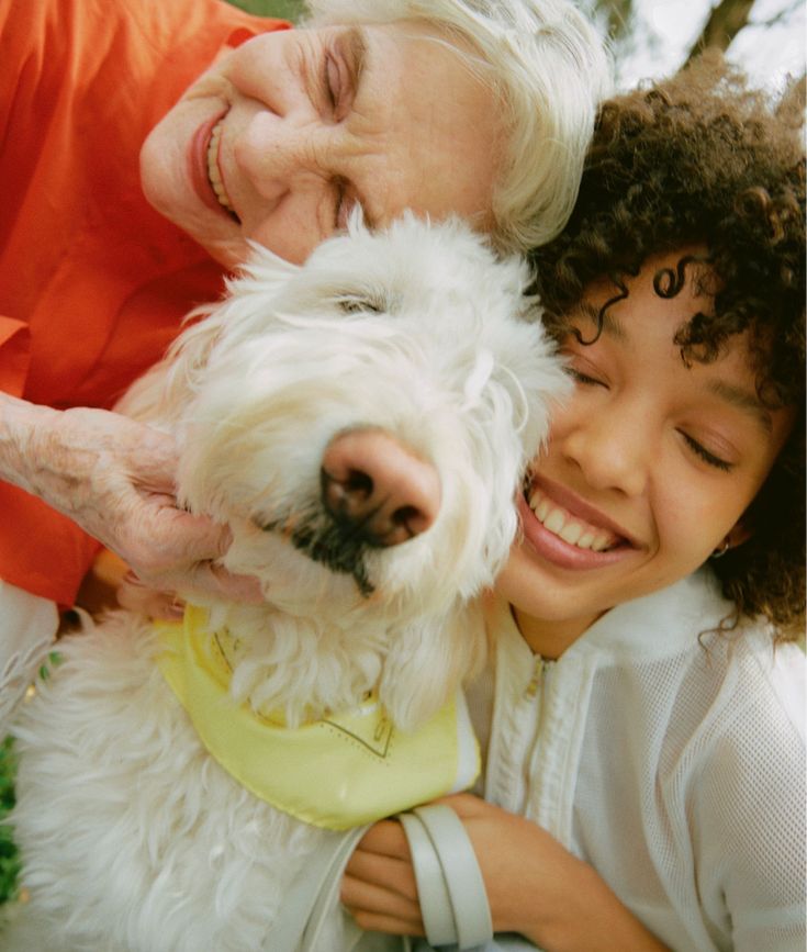 Grandmother and granddaughter with dog